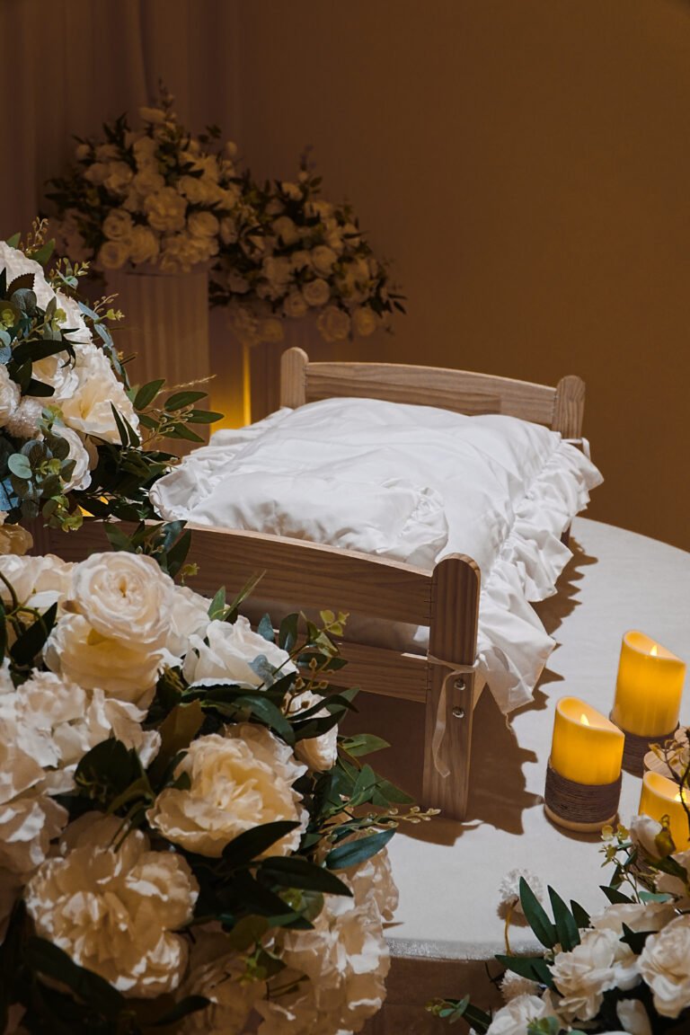 Close-up of a pet memorial bed with roses and candles at Furwell